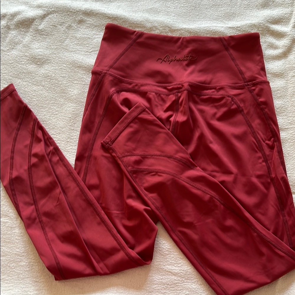 Alphalete rusty rose leggings, size Medium